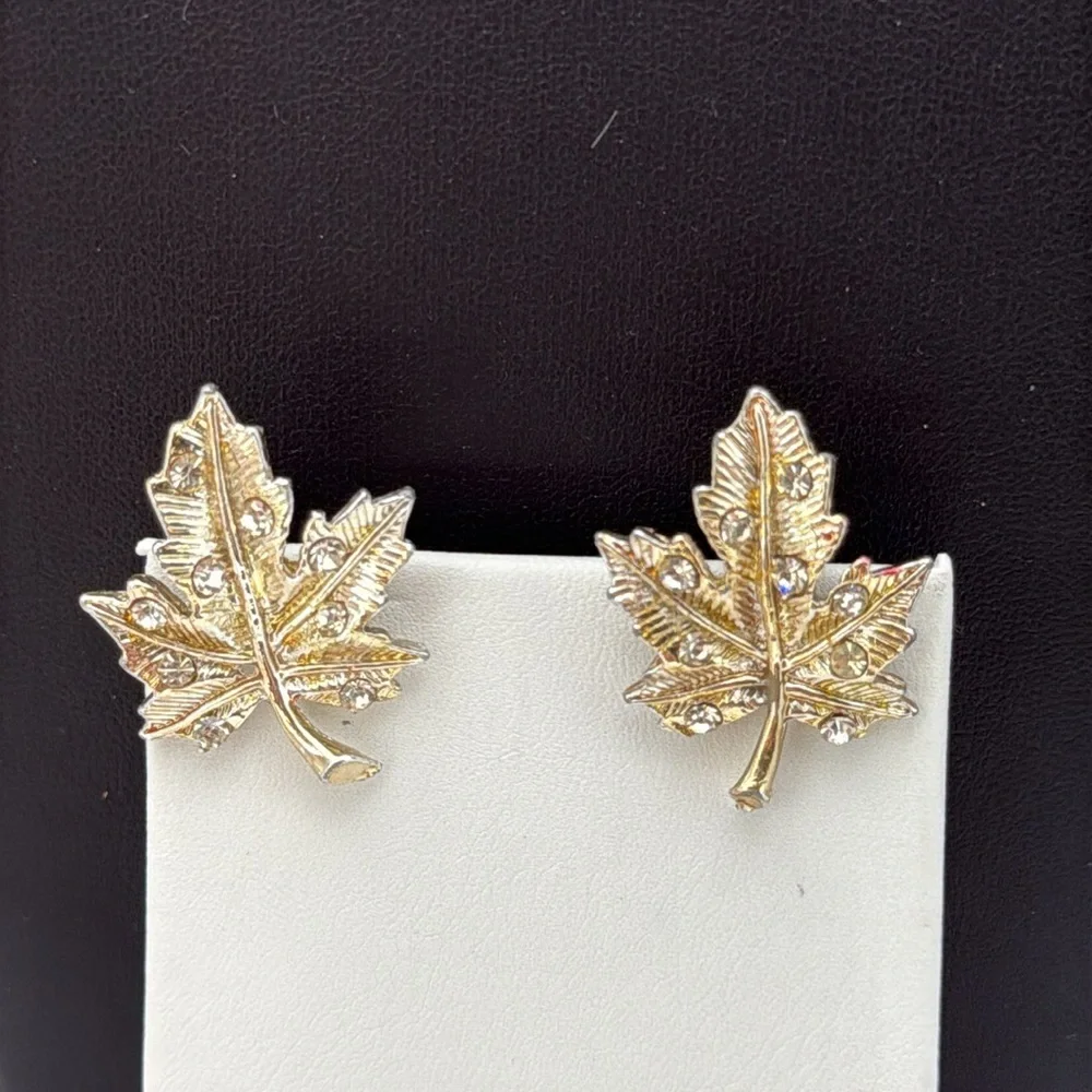 Gold tone textured leaf rhinestone accent screw back statement earrings